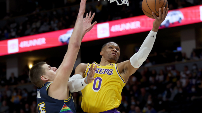 Russell Westbrook of the Los Angeles Lakers goes to the basket against Nikola Jokic of the Denver Nuggets