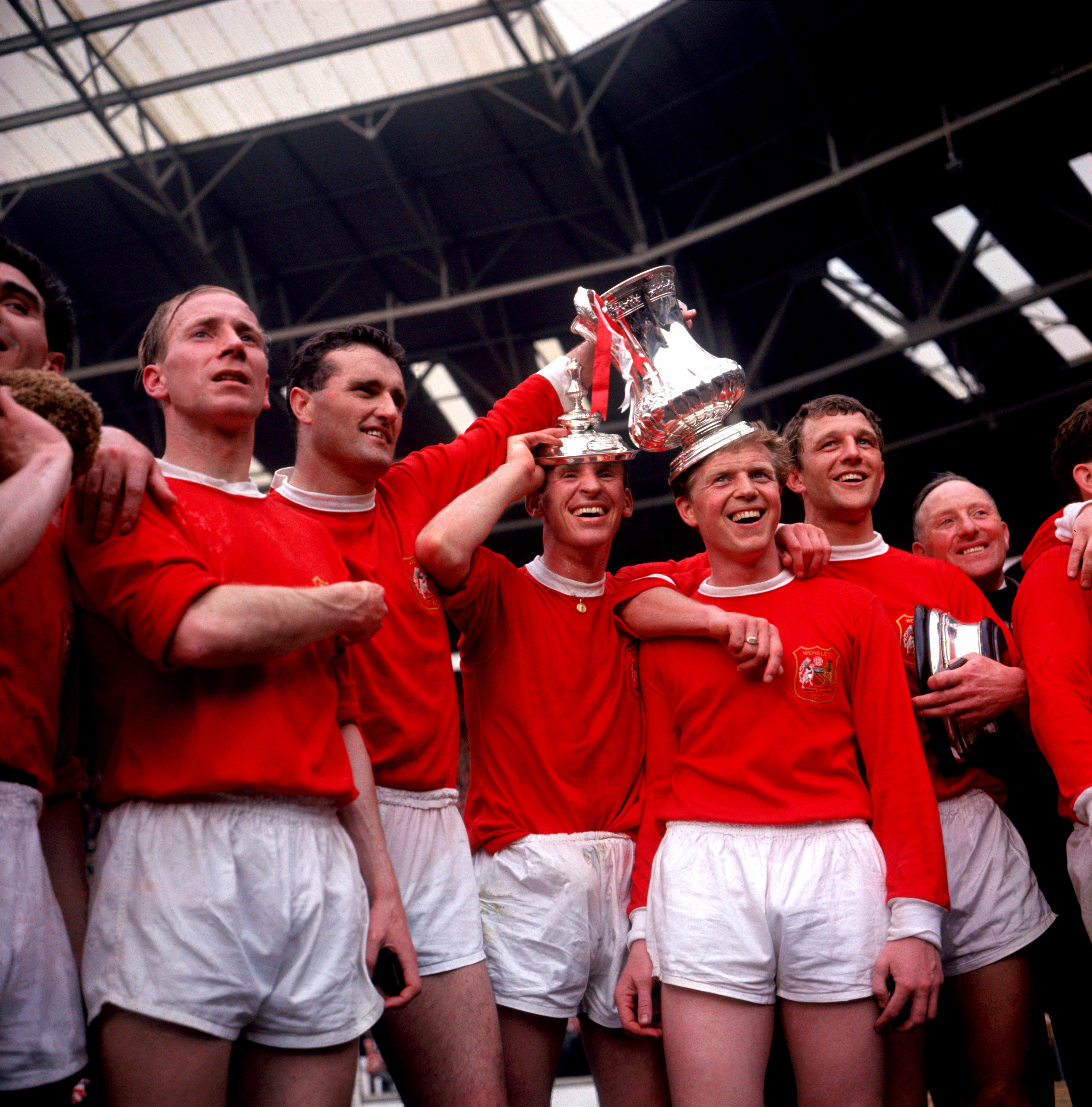 Charlton (left) celebrates after the 1963 FA Cup final triumph against Leicester