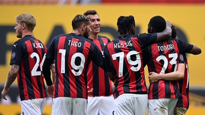 Milan celebrate their winner against Genoa