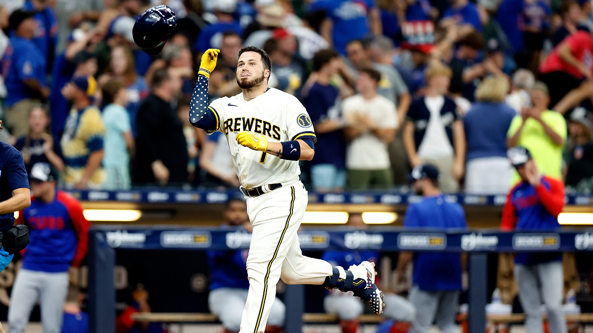 Victor Caratini throws his helmet in celebration as he rounds the bases on his walk-off home run