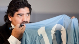 Diego Maradona pictured with his famous Napoli top in 2013