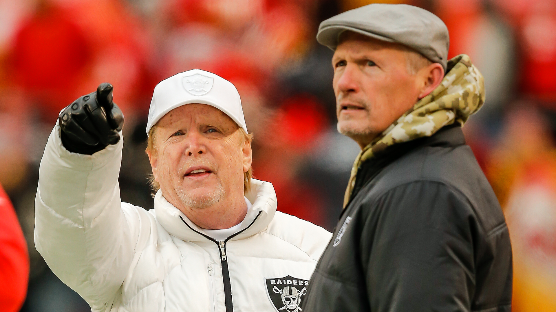 Las Vegas Raiders owner Mark Davis, left, watches his team during warmups with Oakland Raiders general manager Mike Mayock