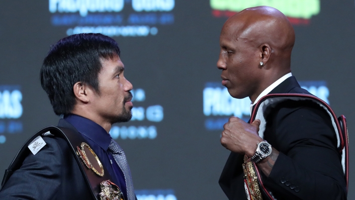 Manny Pacquiao (L) and Yordenis Ugas size each other up before fight night