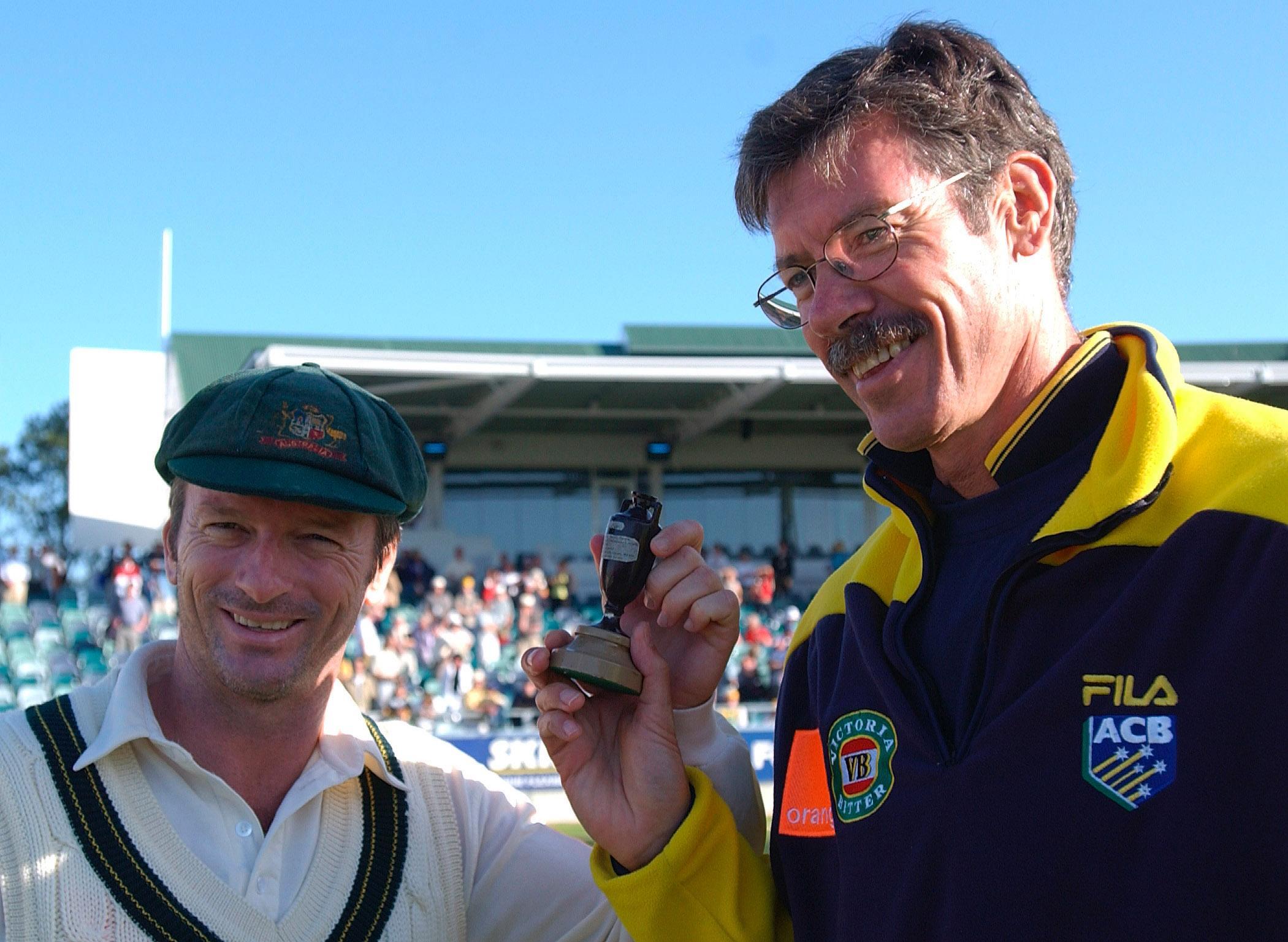 Former Australia coach John Buchanan (right) celebrates an Ashes win with Steve Waugh.