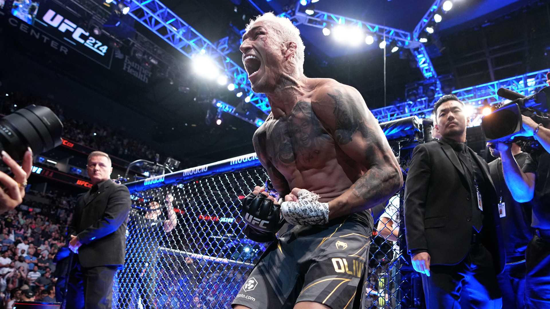 Charles Oliveira celebrates his win at UFC 274