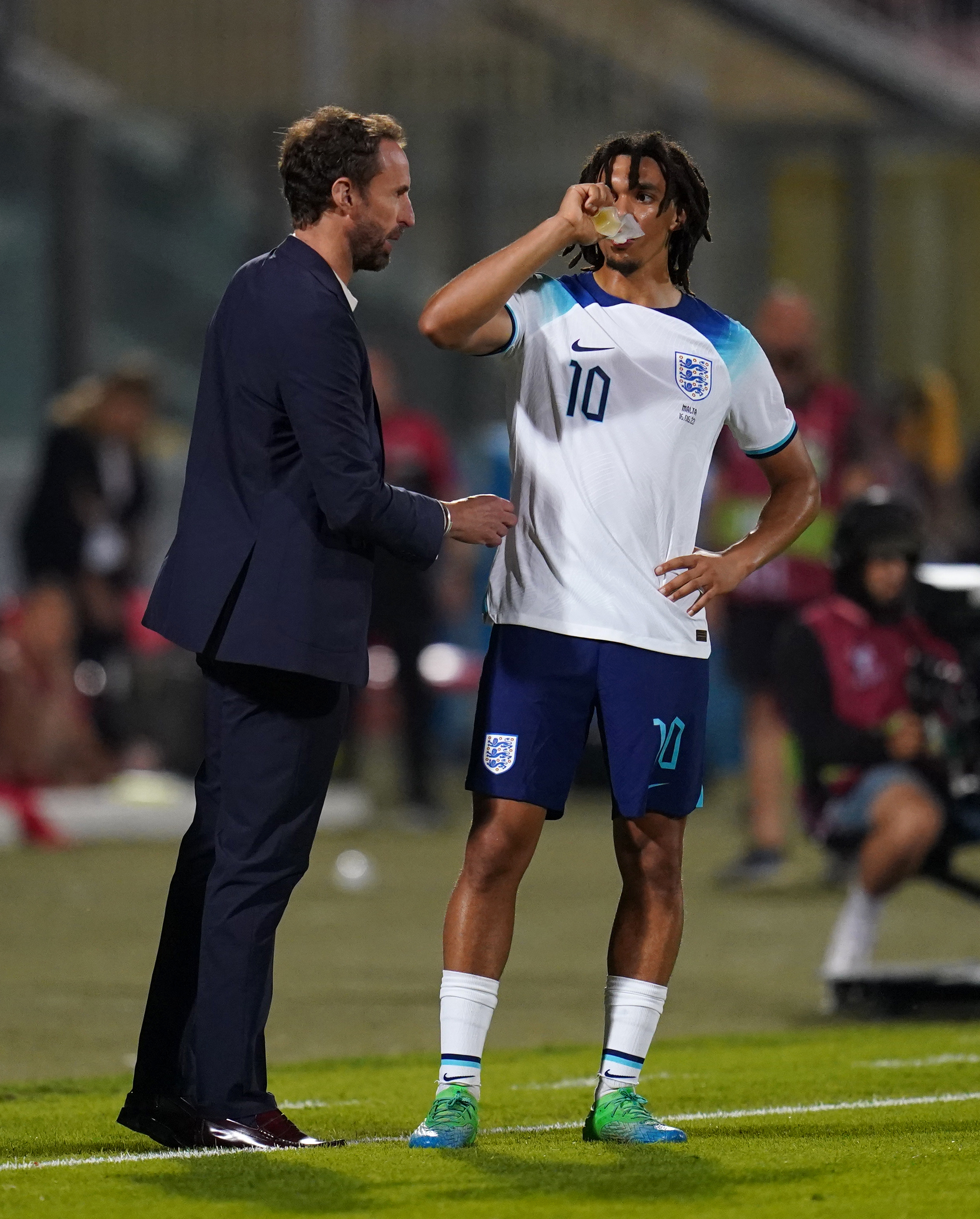 England manager Gareth Southgate and Trent Alexander-Arnold speak on the touchline during the match against Malta