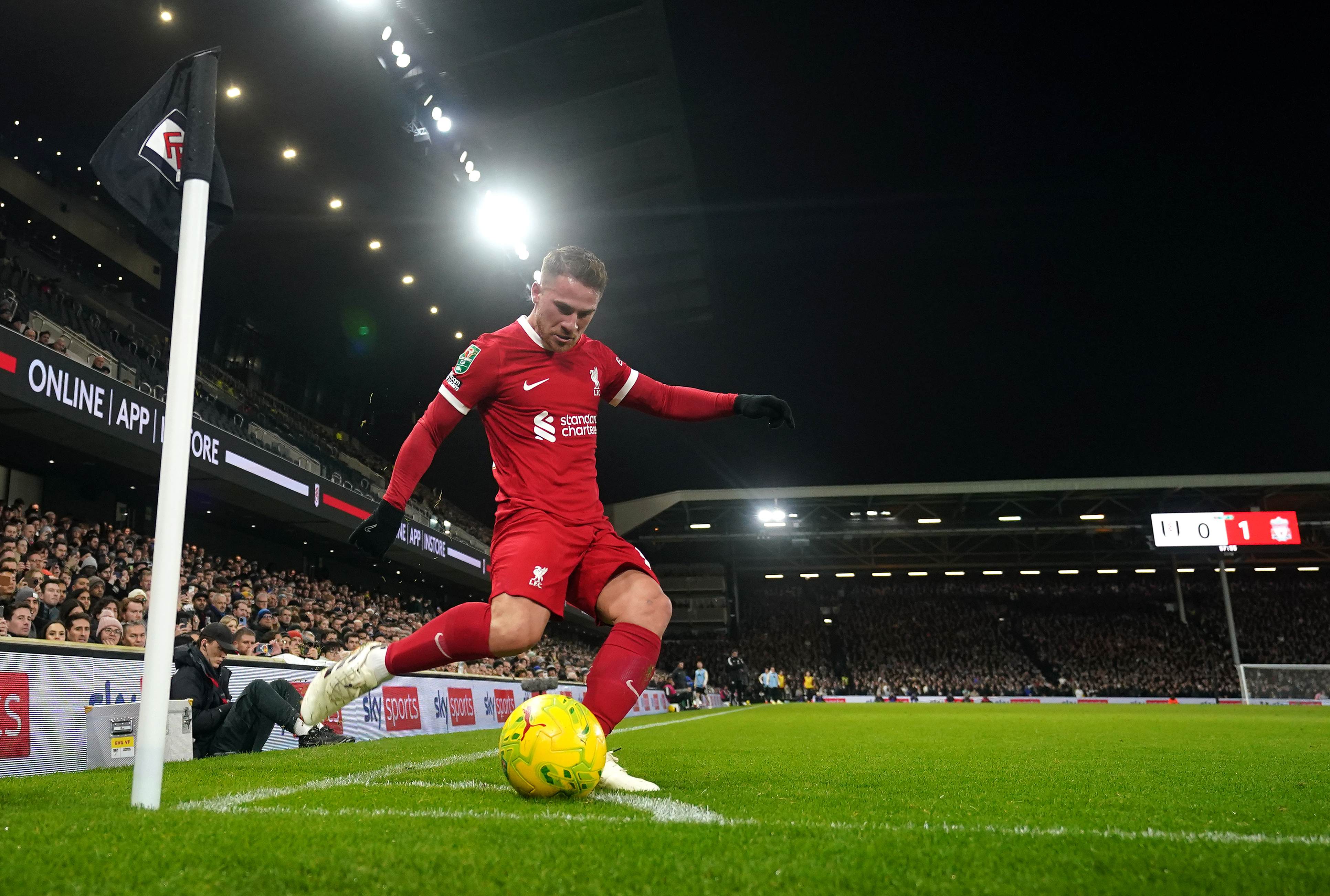 Liverpool’s Alexis Mac Allister takes a corner