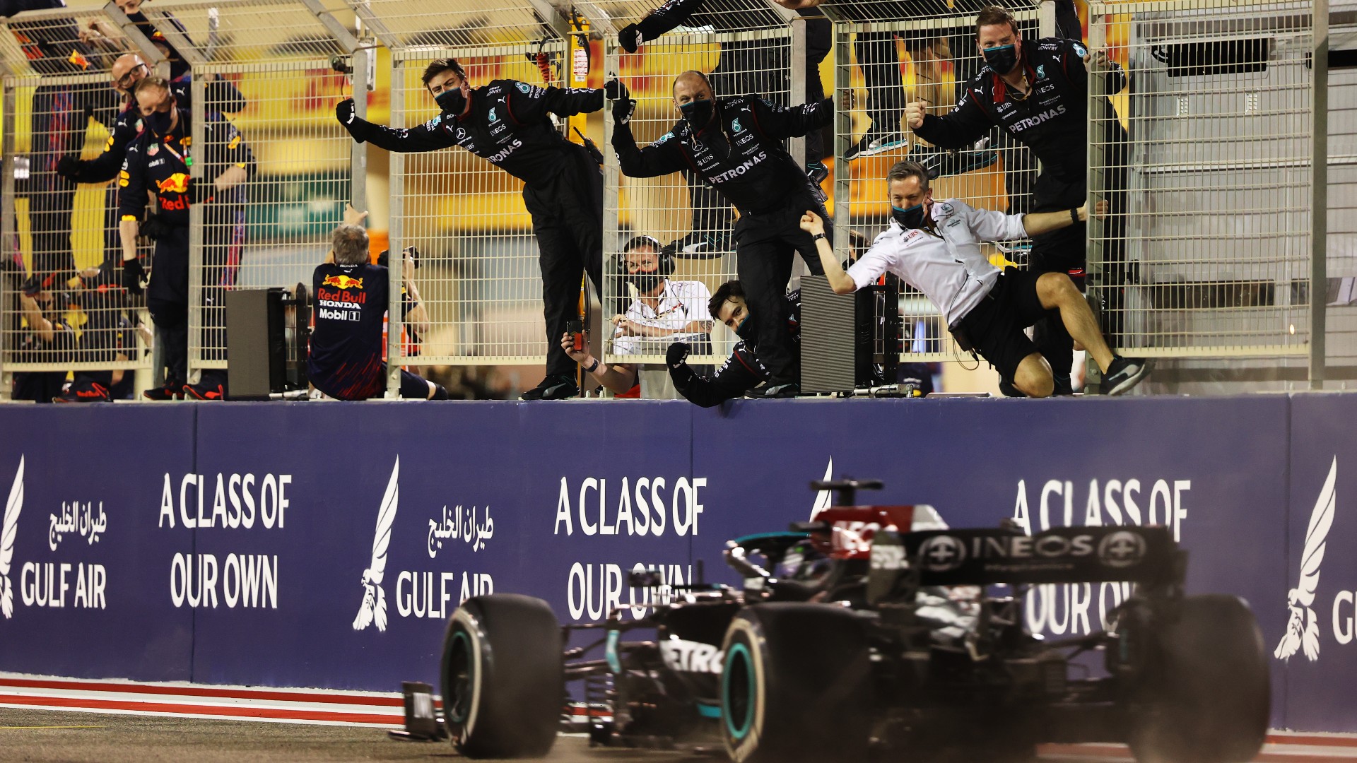 Mercedes celebrate as Lewis Hamilton crosses the line to win the Bahrain Grand Prix