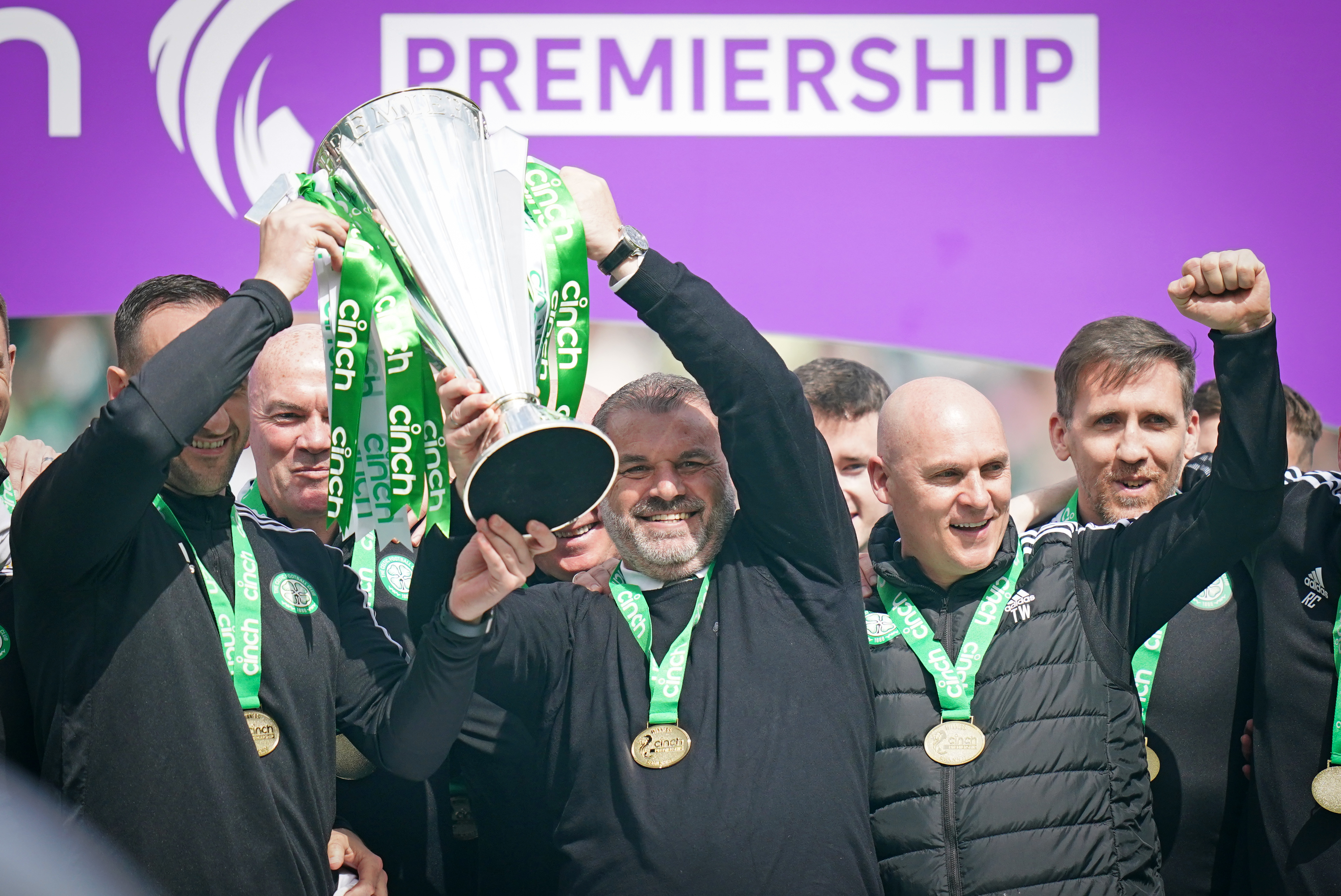 Celtic manager Ange Postecoglou (centre) celebrates with the league trophy
