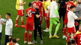 Wales boss Rob Page and Gareth Bale hug at the World Cup