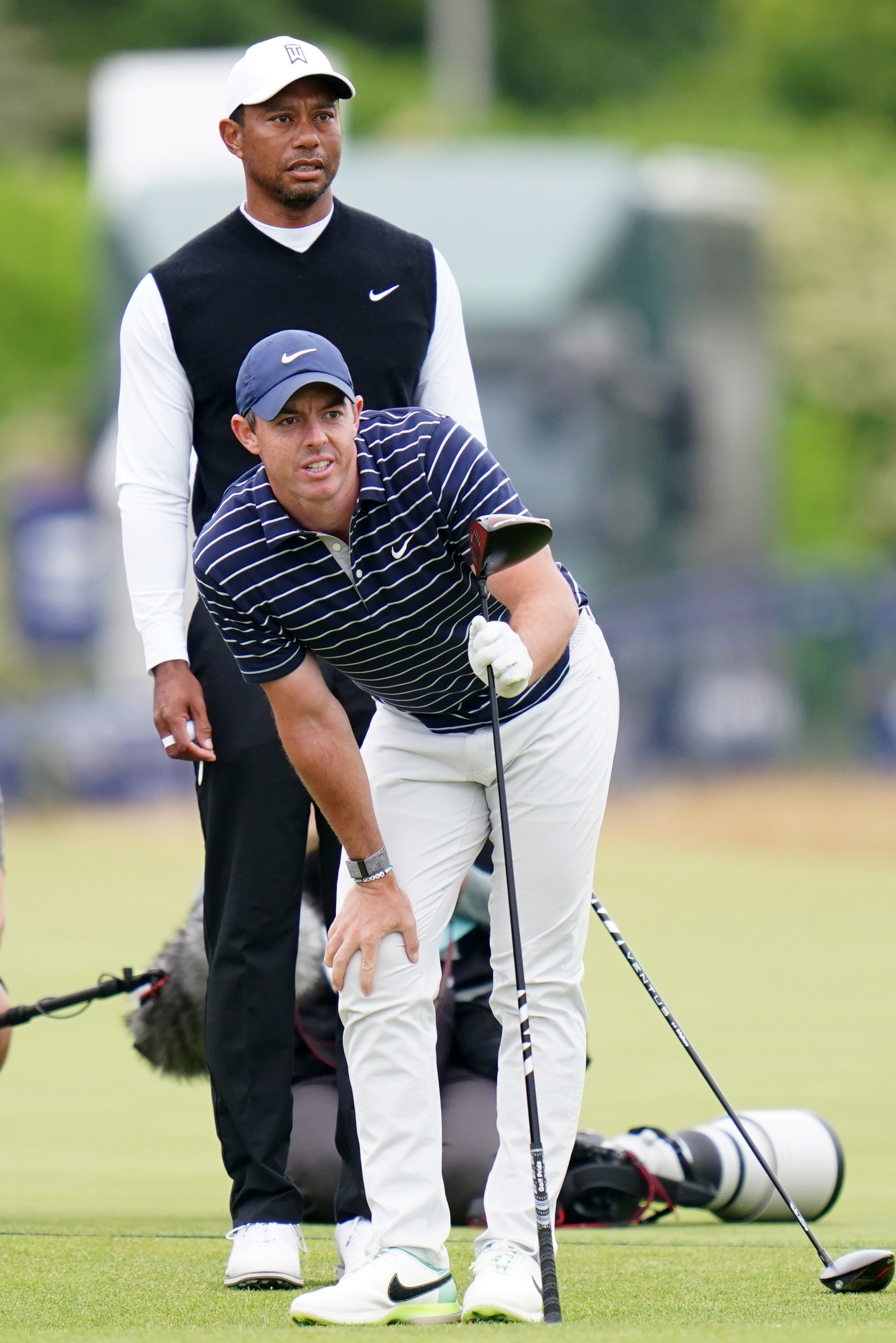 Tiger Woods, rear, and Rory McIlroy