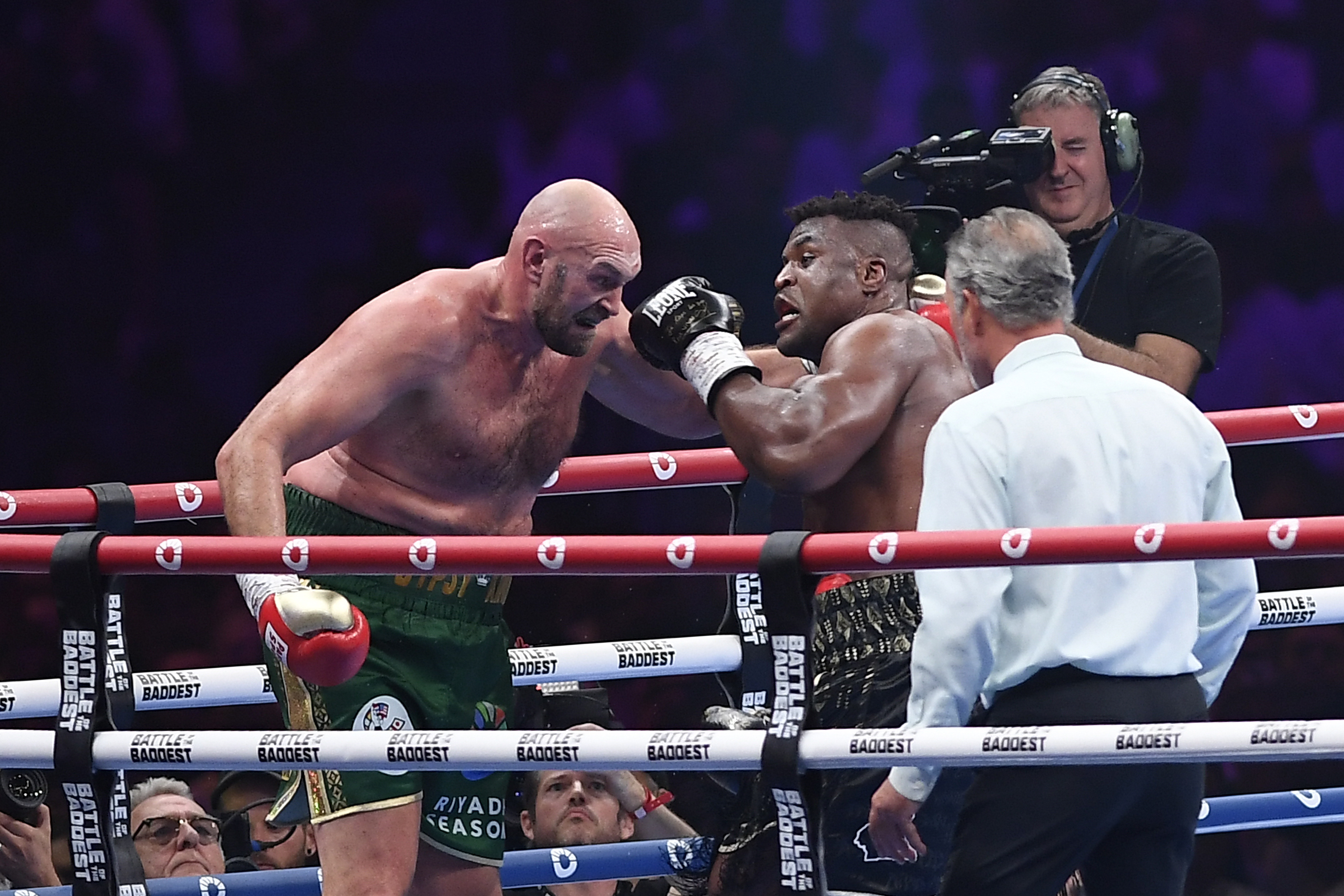 Tyson Fury, left, was put down in the third round (Yazeed Aldhawaihi/AP)