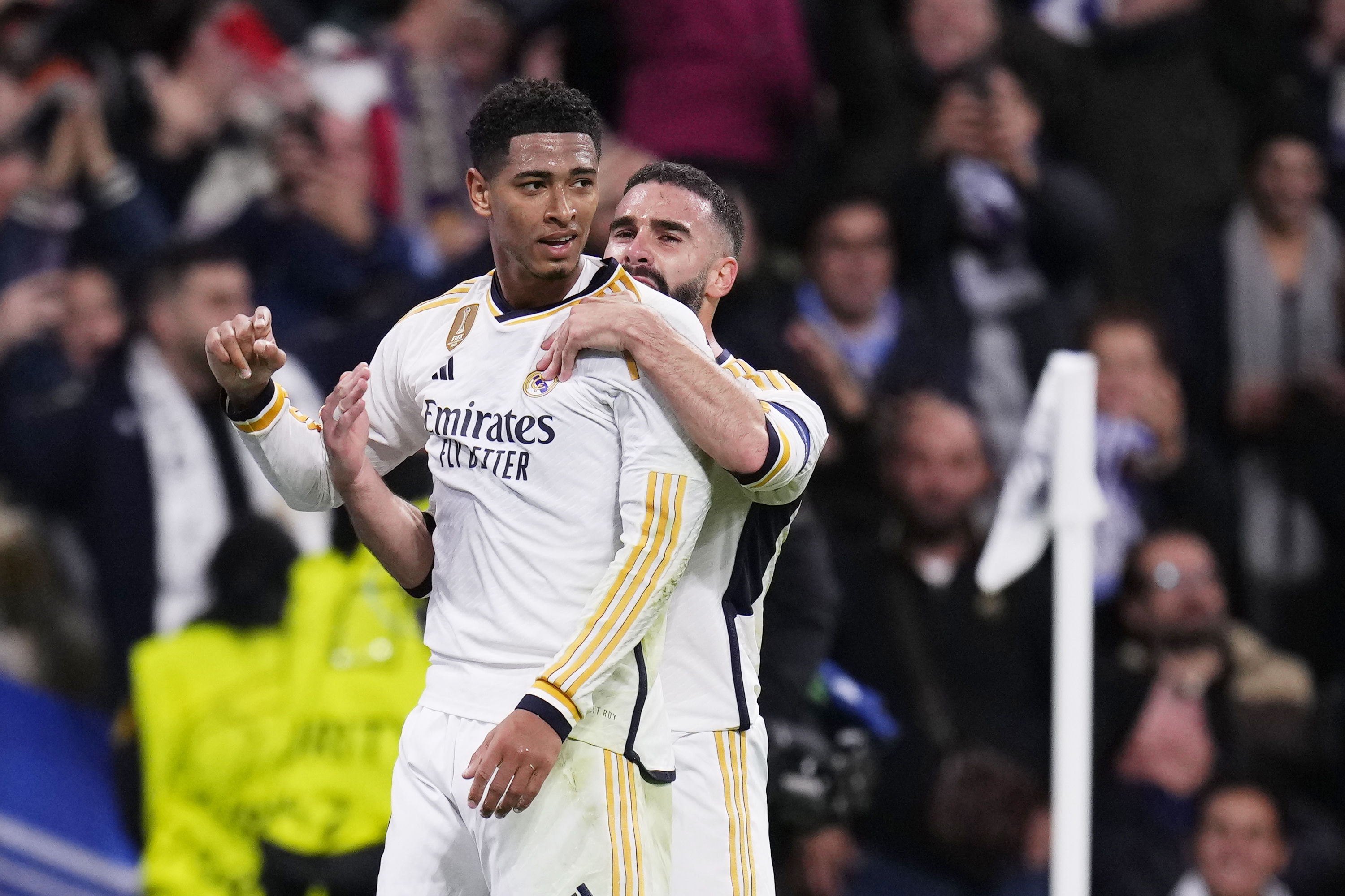 Jude Bellingham, left, celebrates with Real Madrid’s Dani Carvajal after scoring against Napoli