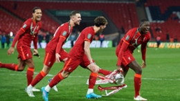 Virgil van Dijk and Jordan Henderson join the celebrations after Liverpool's EFL Cup final win against Chelsea.