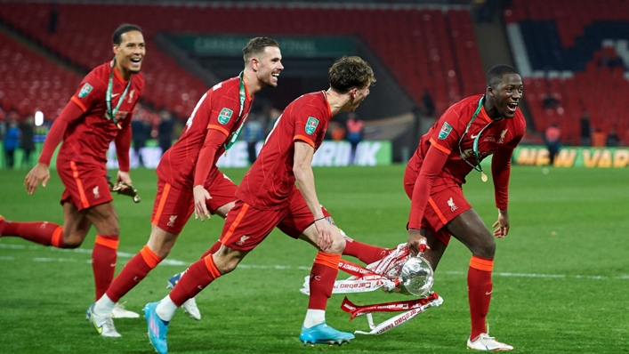 Virgil van Dijk and Jordan Henderson join the celebrations after Liverpool's EFL Cup final win against Chelsea.