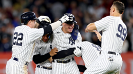 Josh Donaldson of the New York Yankees is congratulated by Harrison Bader, Gleyber Torres, Anthony Rizzo and Aaron Judge after driving in the game-winning run