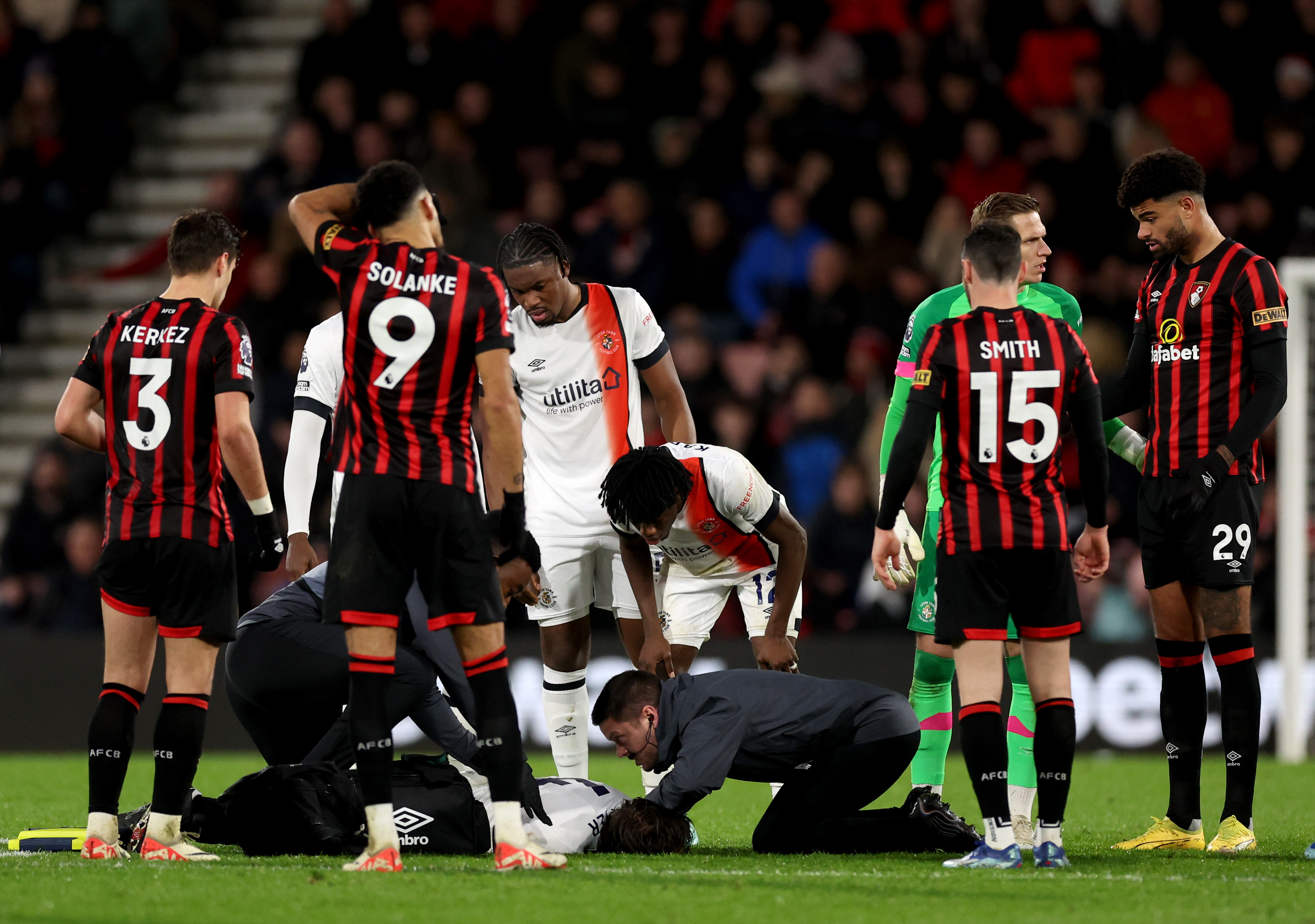 Tom Lockyer receives treatment on the pitch