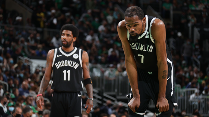 Kevin Durant #7 of the Brooklyn Nets and Kyrie Irving #11 look on during the game against the Boston Celtics