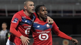 Burak Yilmaz (L) after scoring for Lille against Angers