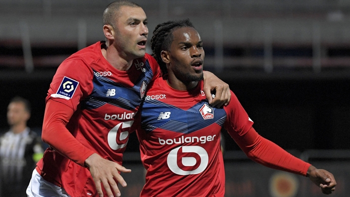 Burak Yilmaz (L) after scoring for Lille against Angers