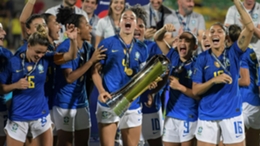 Brazil players celebrate after winning the Copa America Feminina