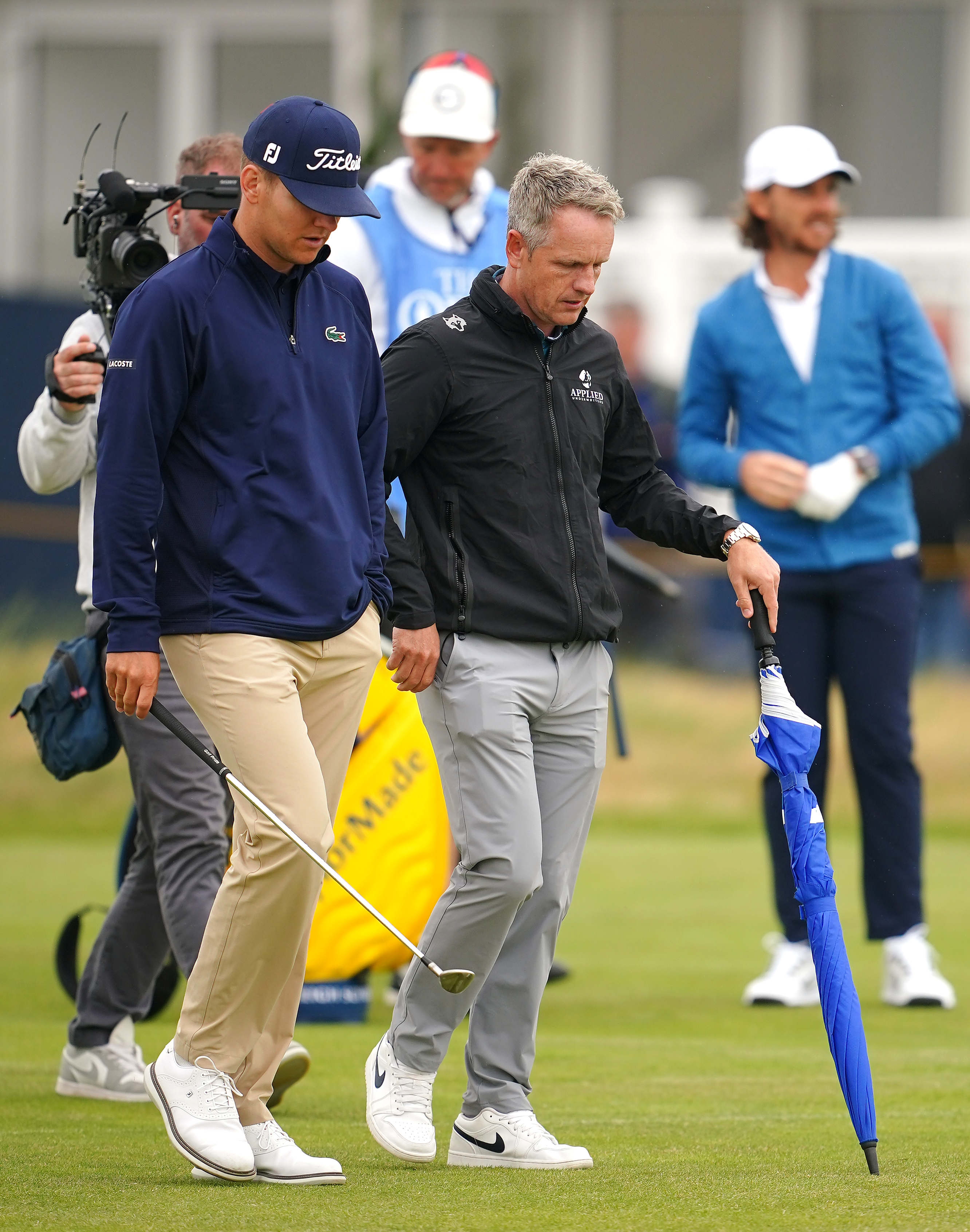 Ryder Cup captain Luke Donald speaks with Germany’s Yannik Paul