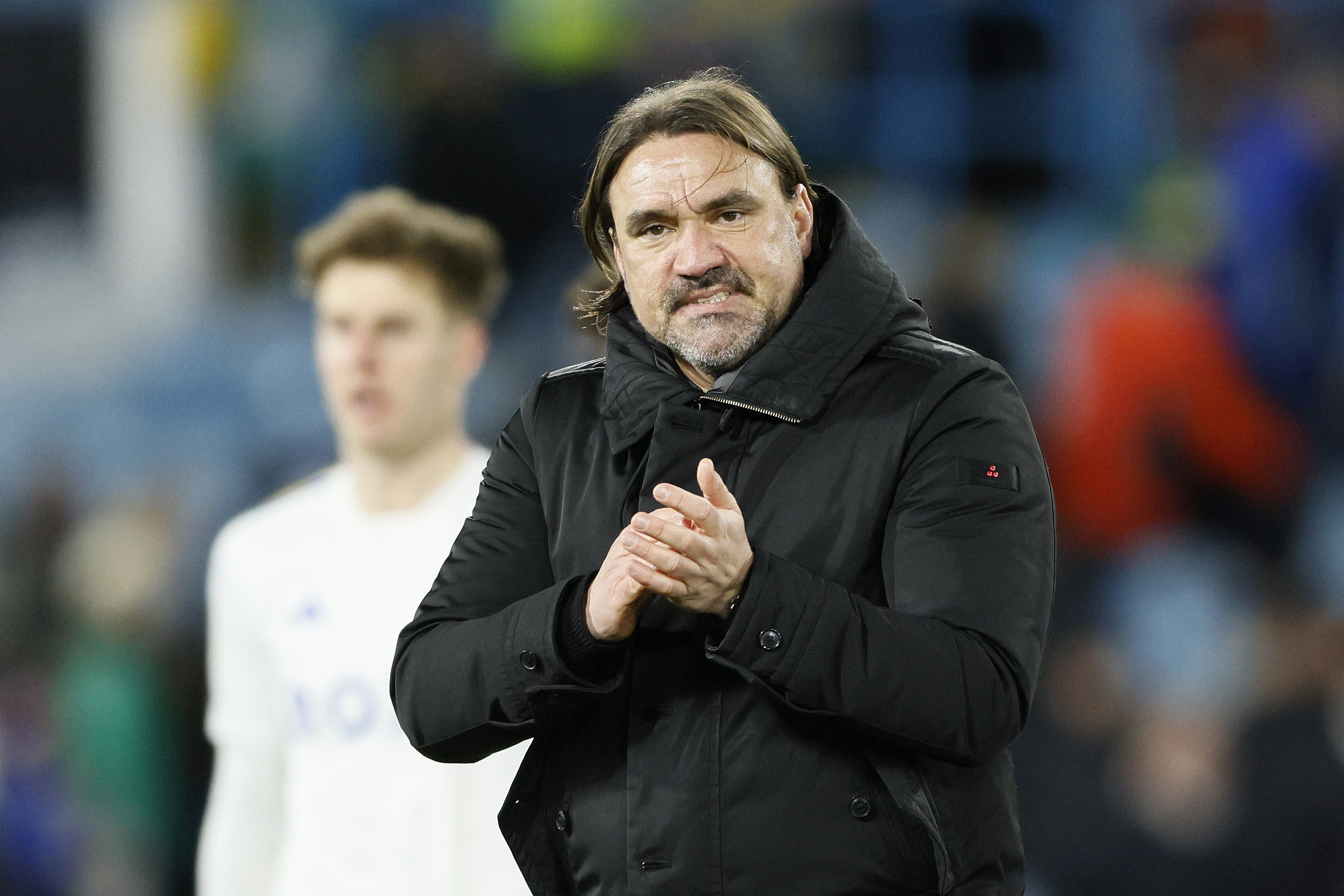 Leeds manager Daniel Farke applauds the fans