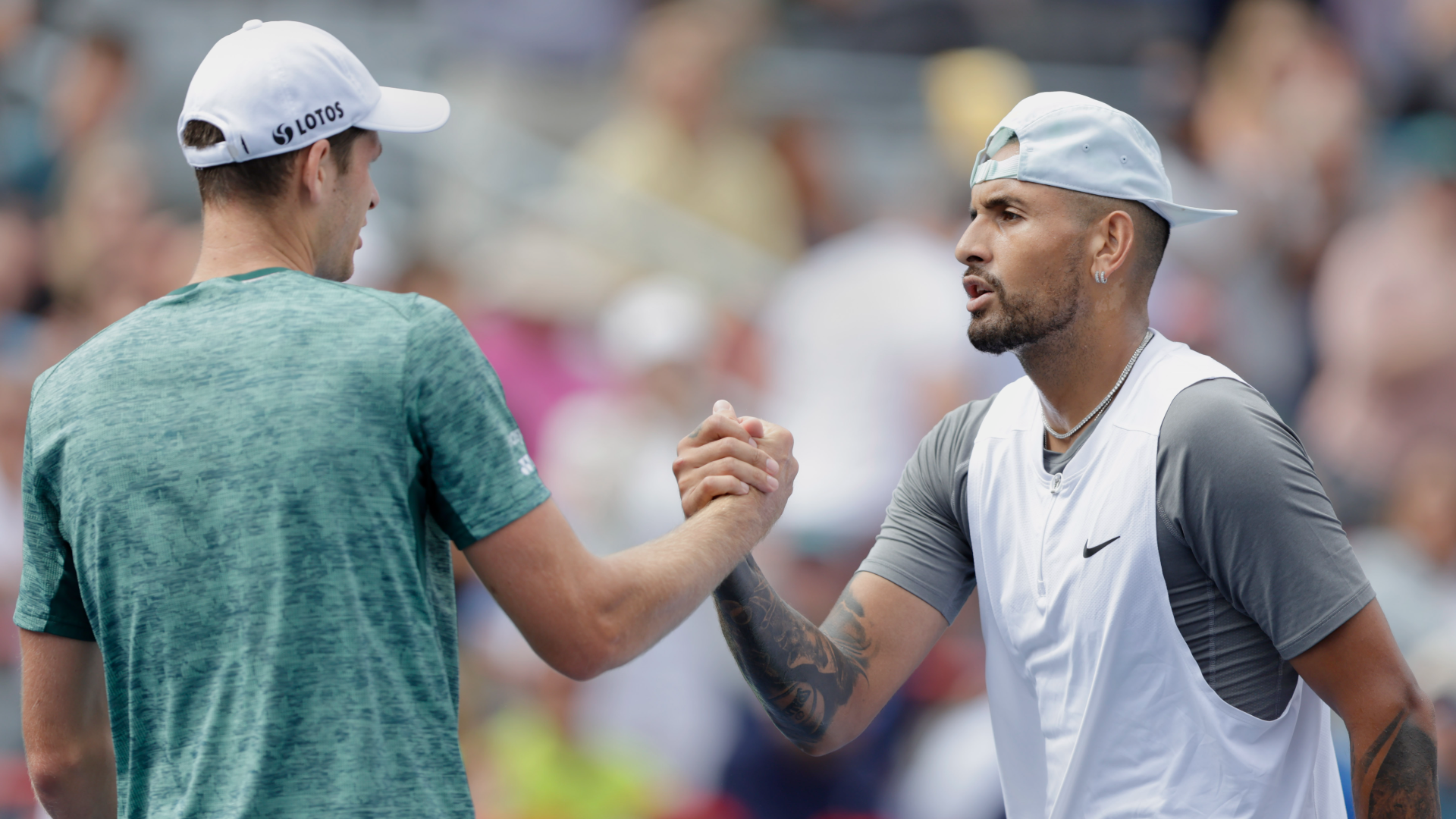 Nick Kyrgios shakes hands with opponent Hubert Hurkacz after losing in the Canadian Open quarter-finals