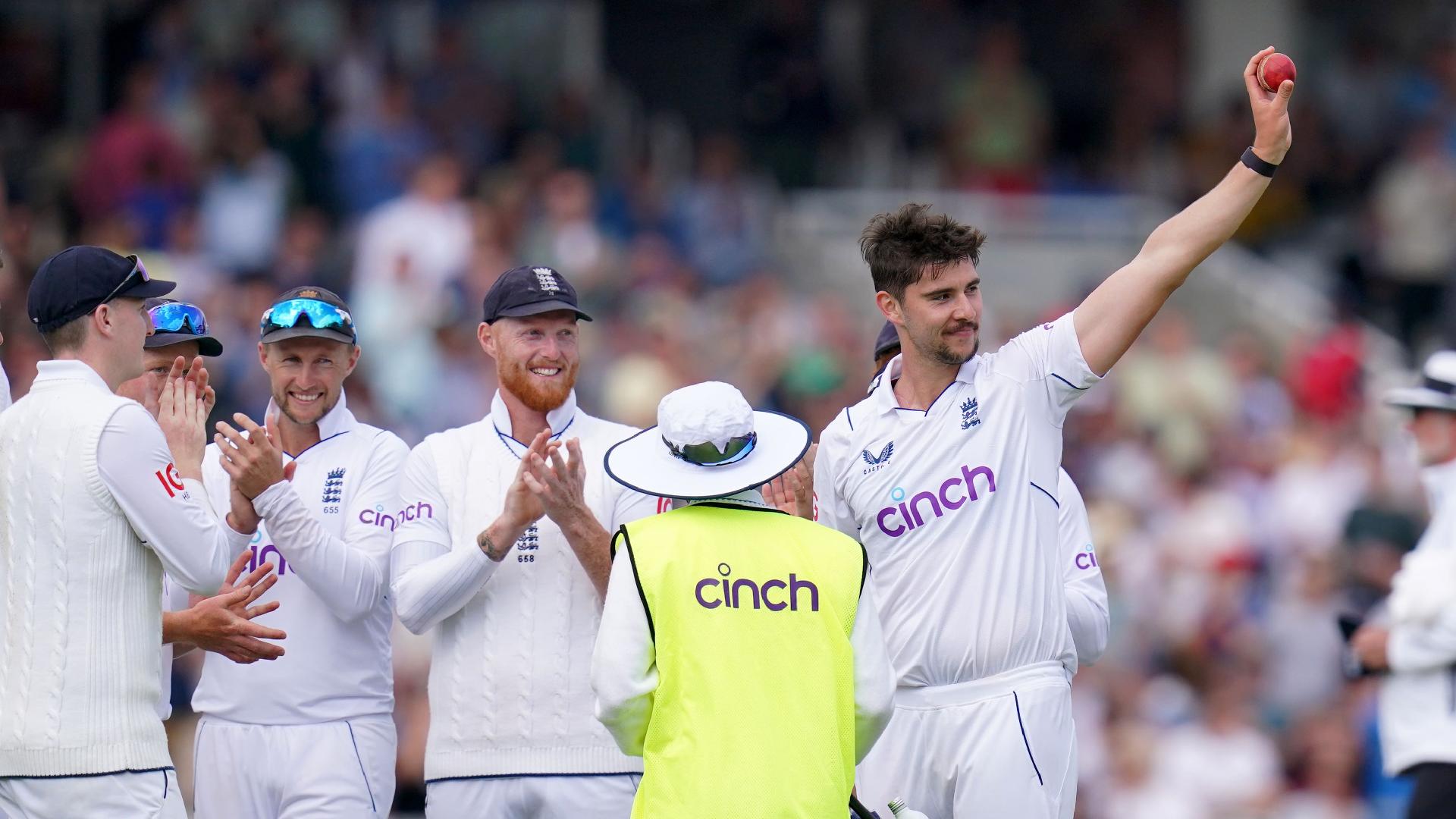 Josh Tongue waves the match ball after claiming a five-wicket haul on debut for England against Ireland (John Walton/PA)
