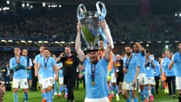 Manchester City’s Kevin De Bruyne lifts the Champions League trophy (Martin Rickett/PA)