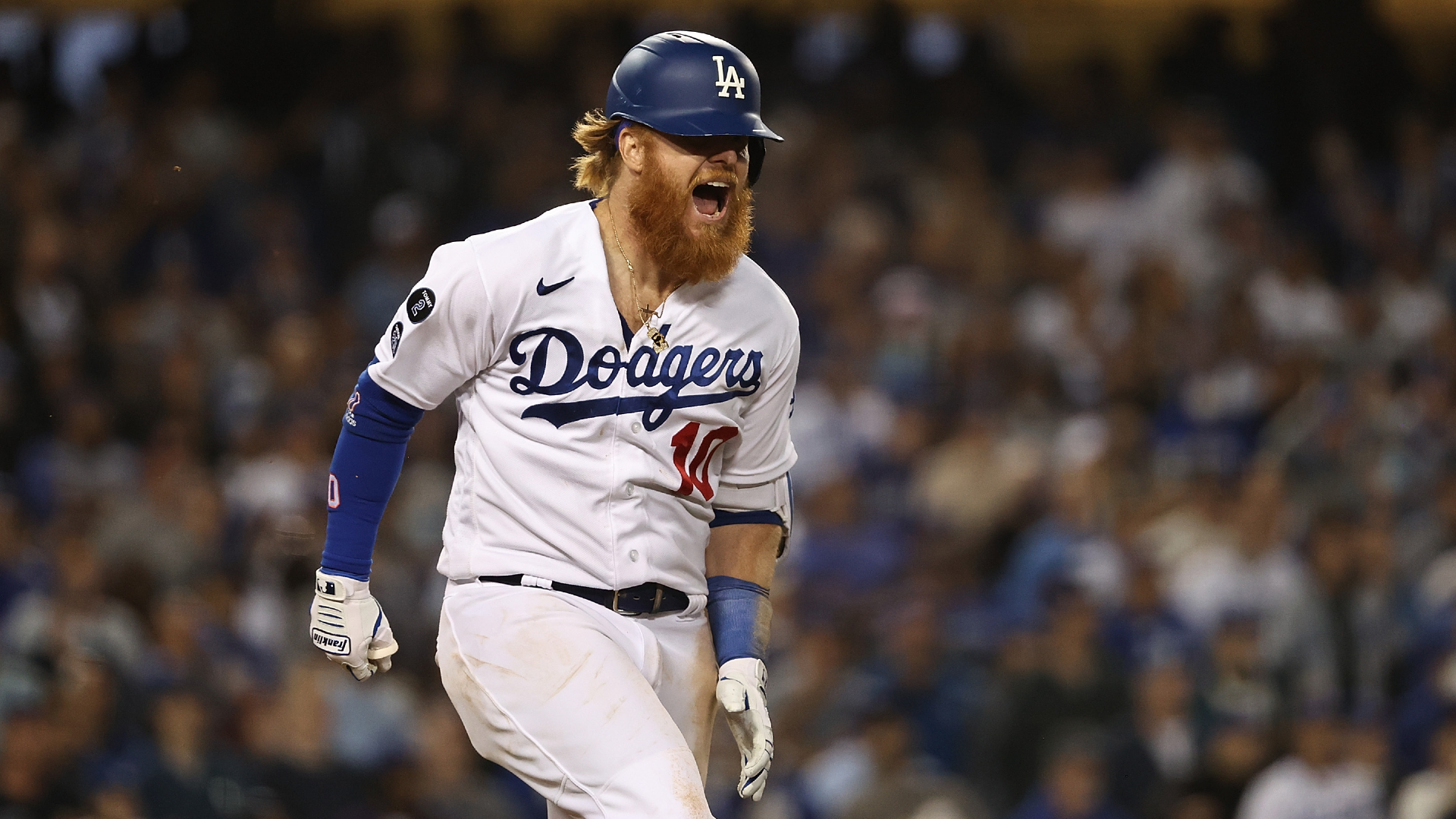 Justin Turner #10 of the Los Angeles Dodgers reacts after suffering an injury during the seventh inning of Game Four of the National League Championship Series against the Atlanta Braves