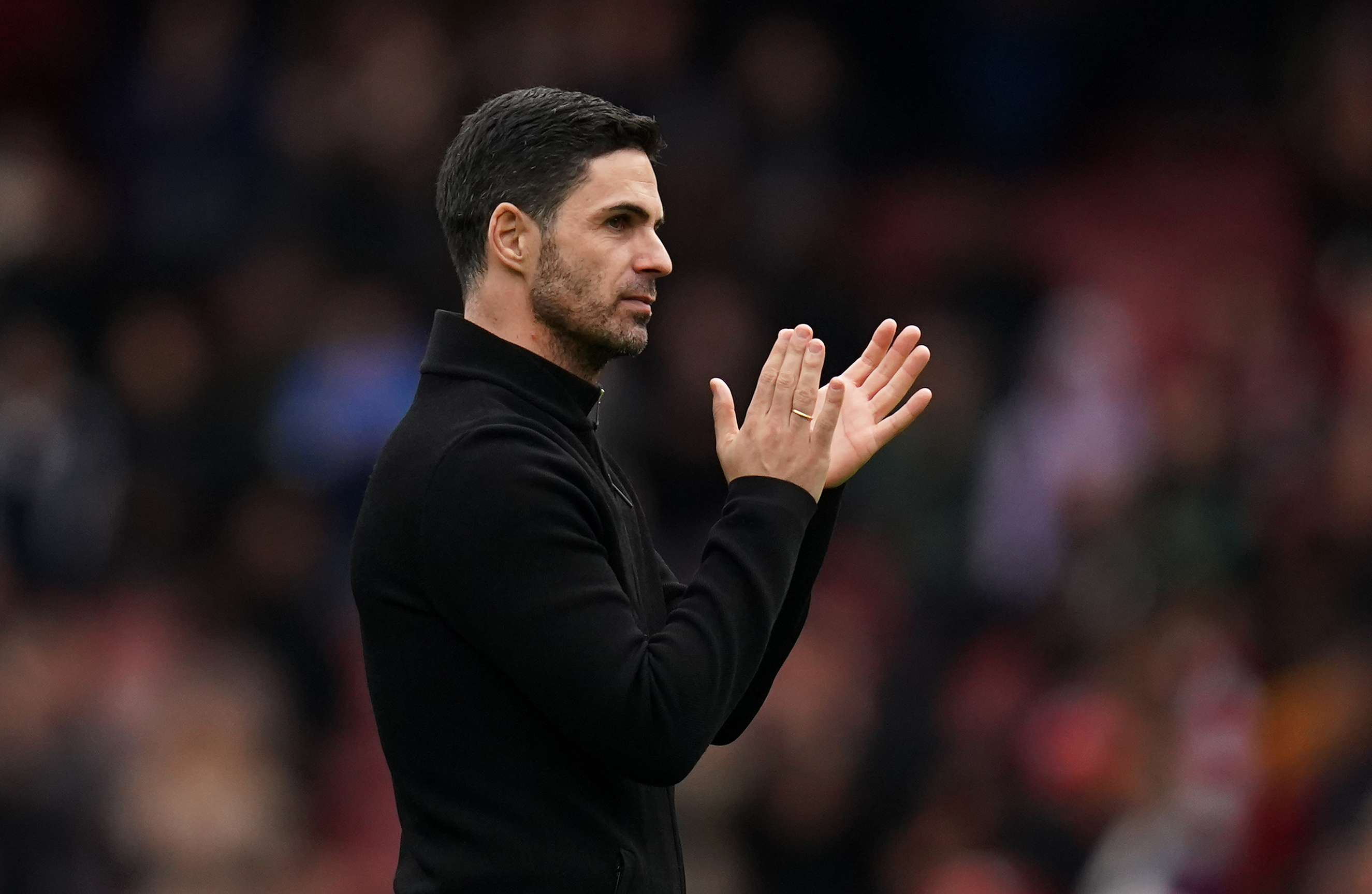 Arsenal manager Mikel Arteta applauds the fans