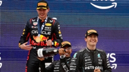 Max Verstappen, left, celebrates his victory on the podium with Lewis Hamilton, centre, and George Russell (Joan Monfort/AP)