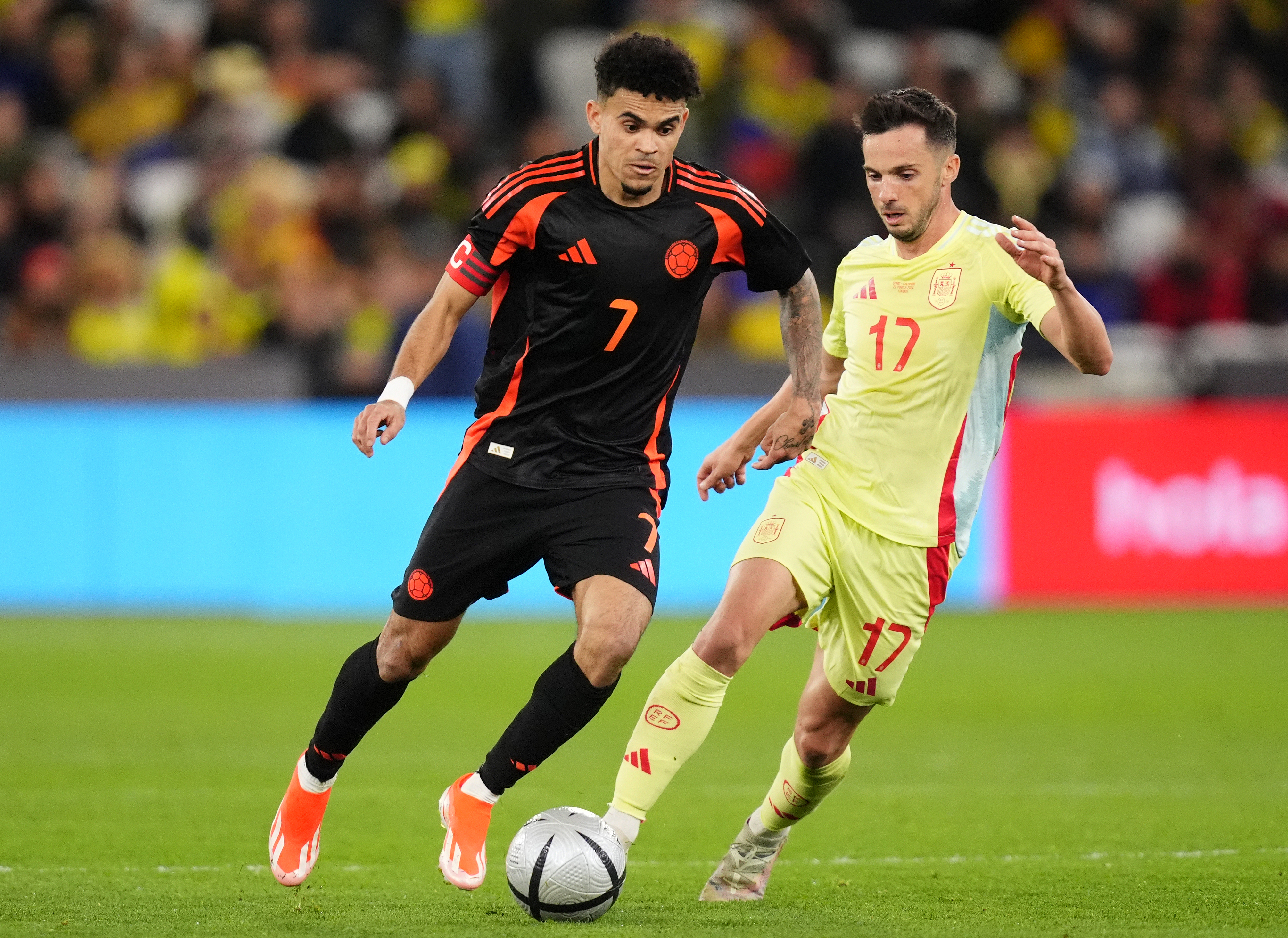 Liverpool's Luis Diaz, left, assisted Colombia's winner