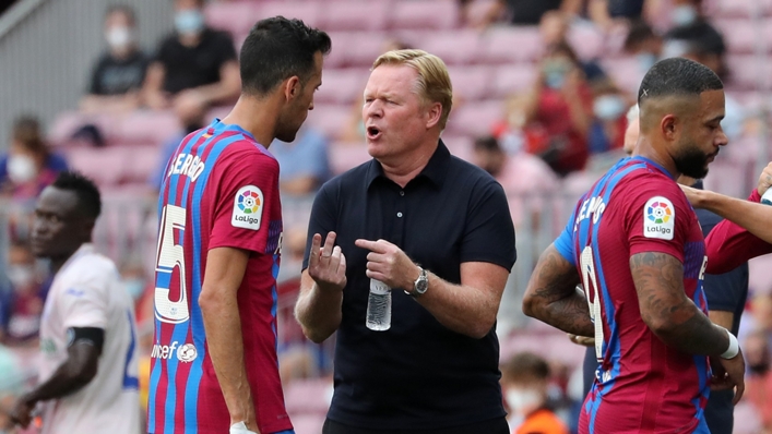 Barcelona's Sergio Busquets and Ronald Koeman