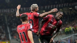 Theo Hernandez, centre, celebrates with Rafael Leao, right, after scoring Milan’s third (Luca Bruno/AP)