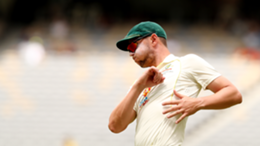 Josh Hazlewood of Australia stretches during day five of the First Test match between Australia and the West Indies