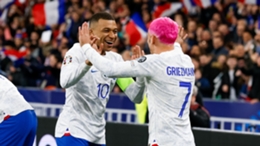 Kylian Mbappe (L) and Antoine Griezmann (R) celebrate during France's 4-0 Euro 2024 qualifying win against the Netherlands