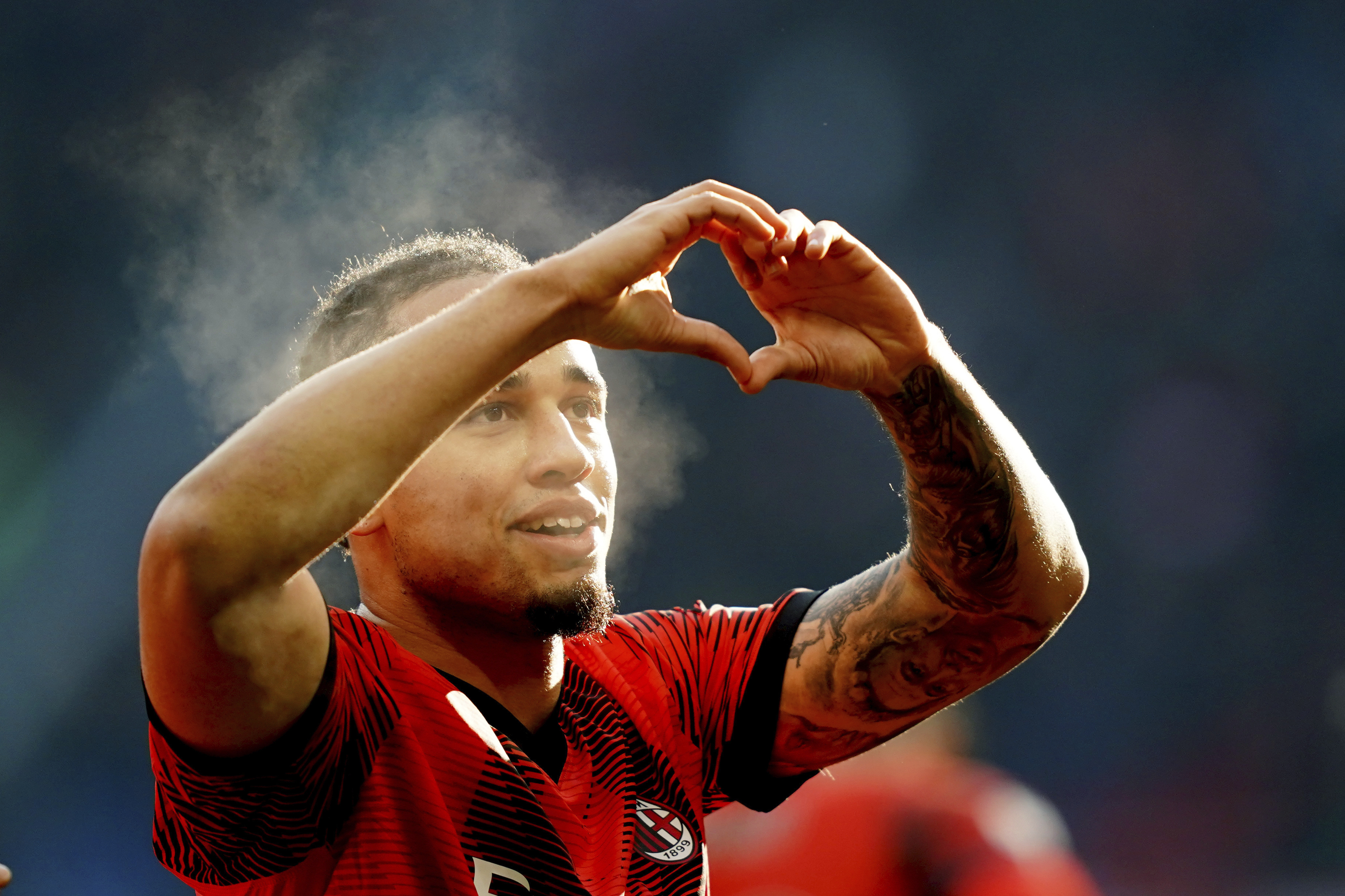 AC Milan’s Noah Okafor celebrates after scoring the third goal against Monza
