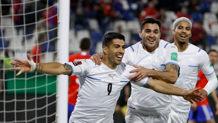 Luis Suarez celebrates scoring against Chile