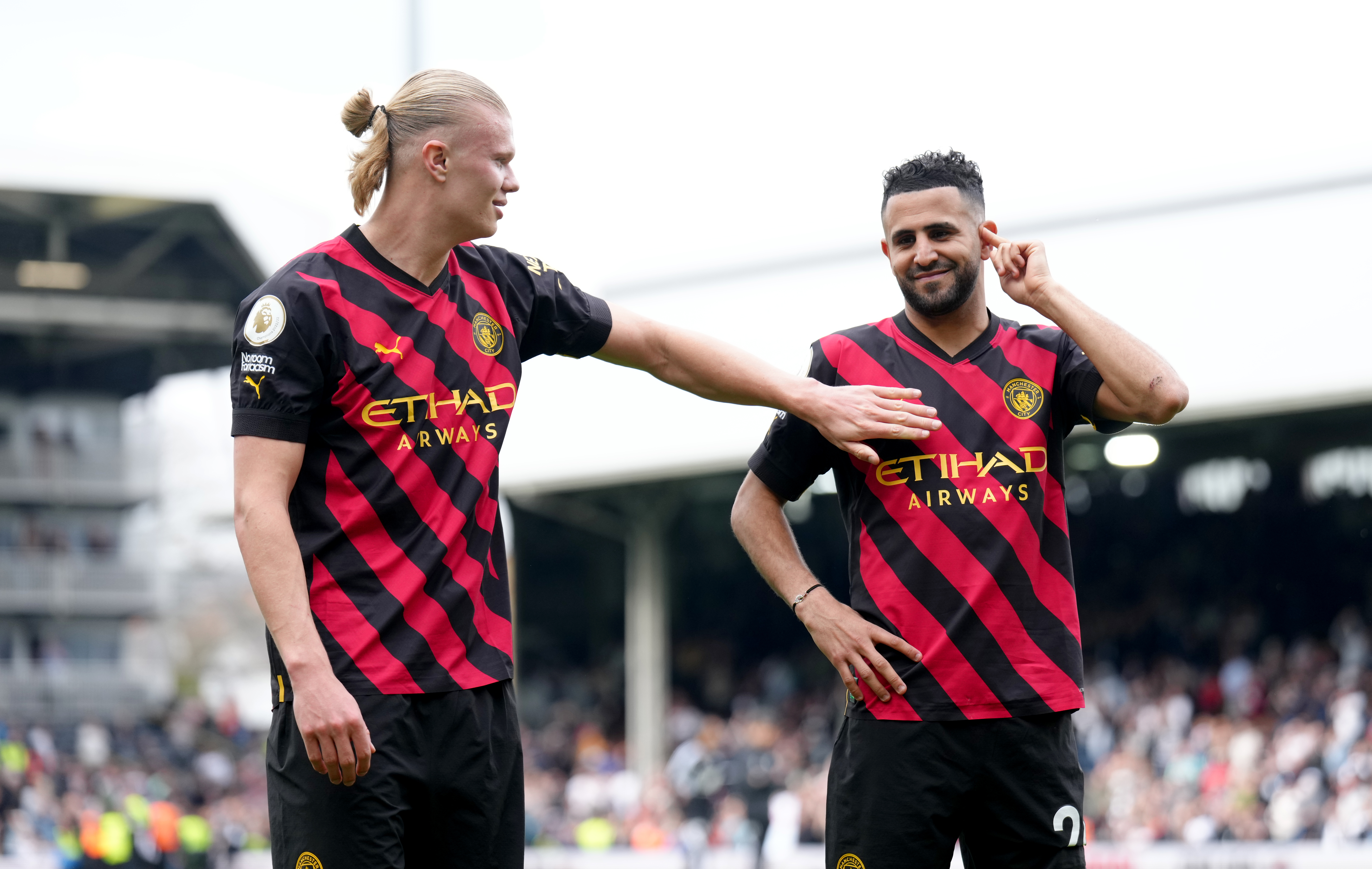 Erling Haaland, left, celebrates his penalty at Fulham which took him to 34 Premier League goals