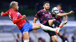 Francisco Calvo of Costa Rica competes for the ball with Henry Martin of Mexico