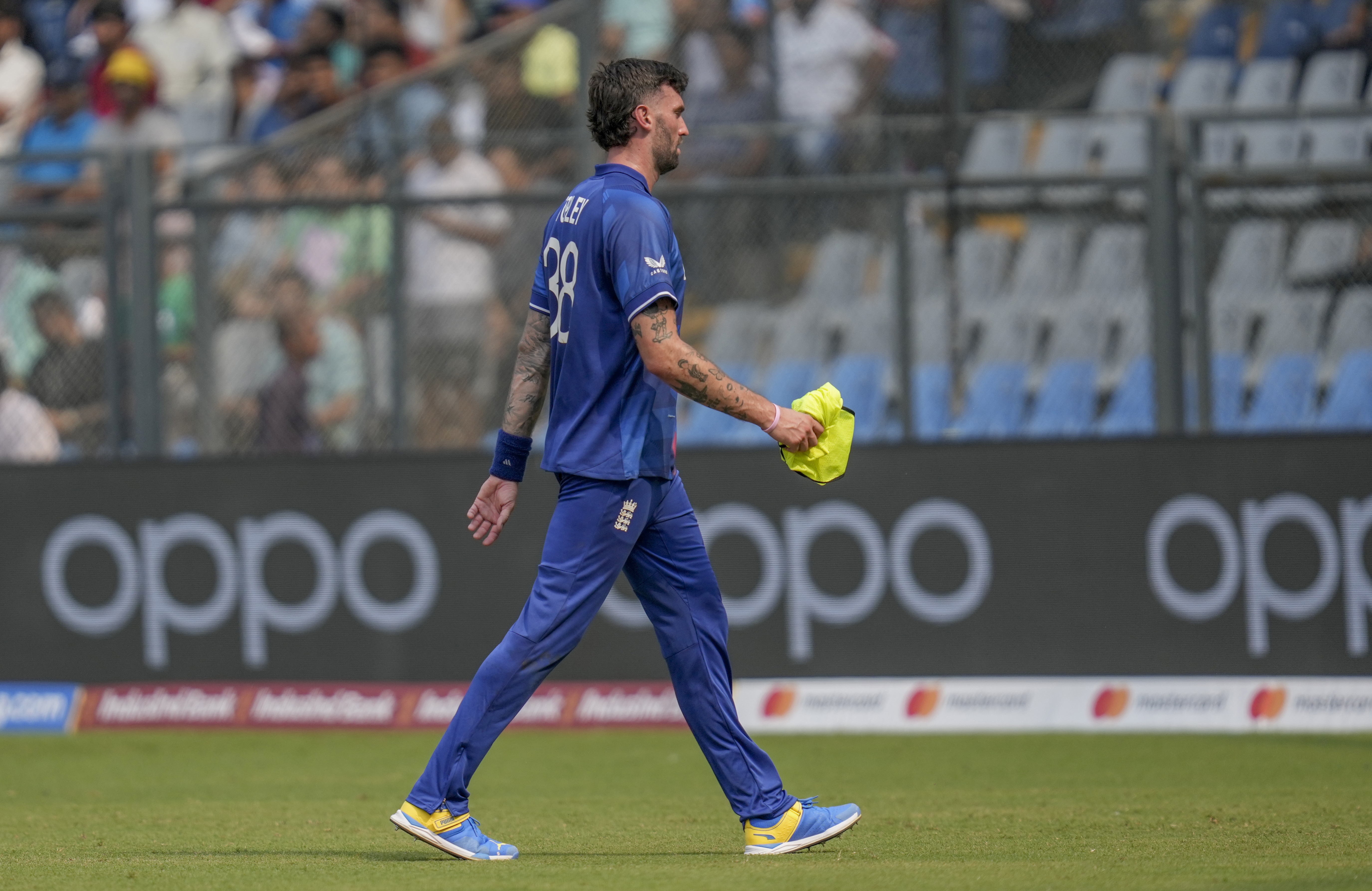 England’s Reece Topley walks off the field after breaking a finger against South Africa