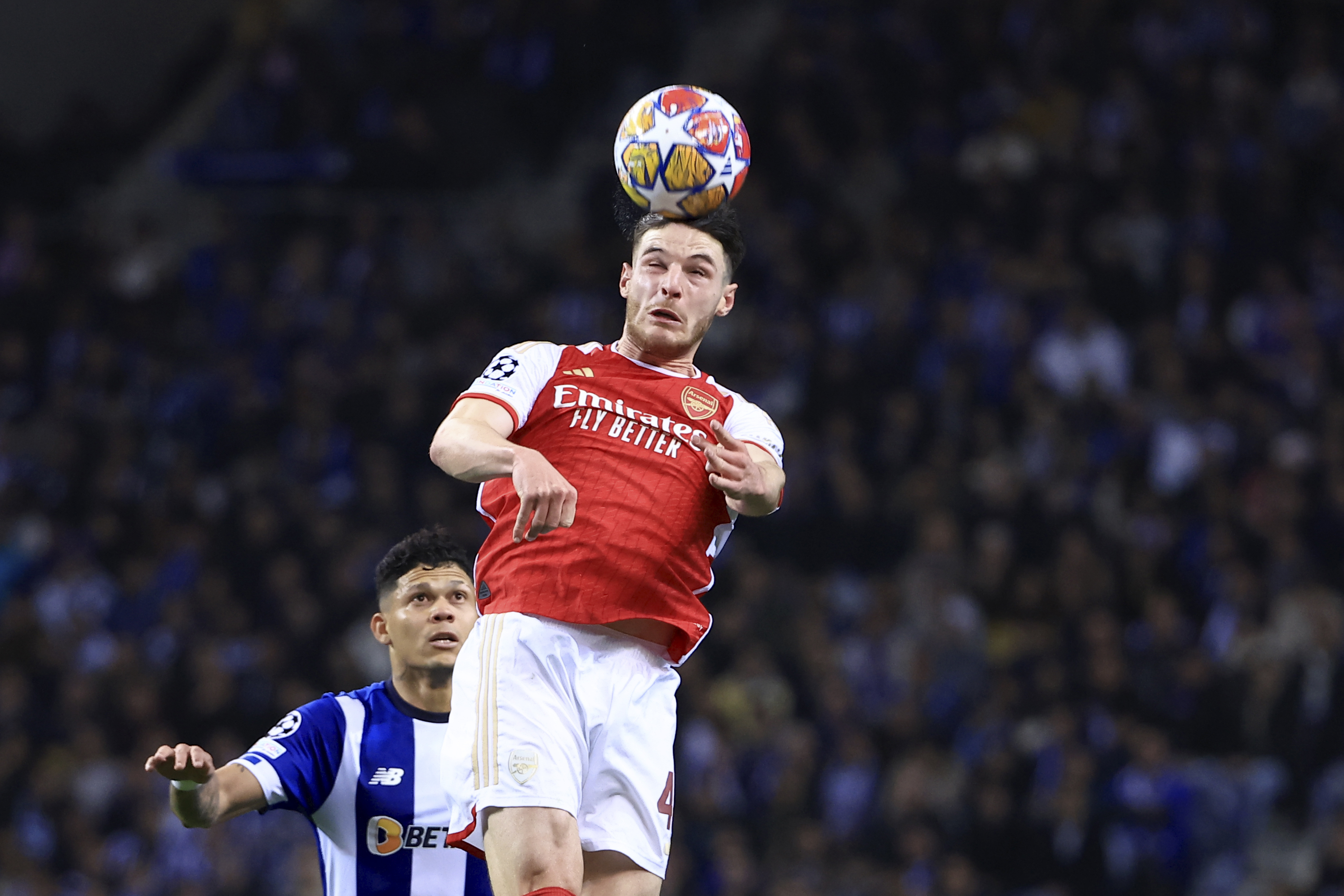 Arsenal’s Declan Rice heads the ball next to Porto’s Evanilson