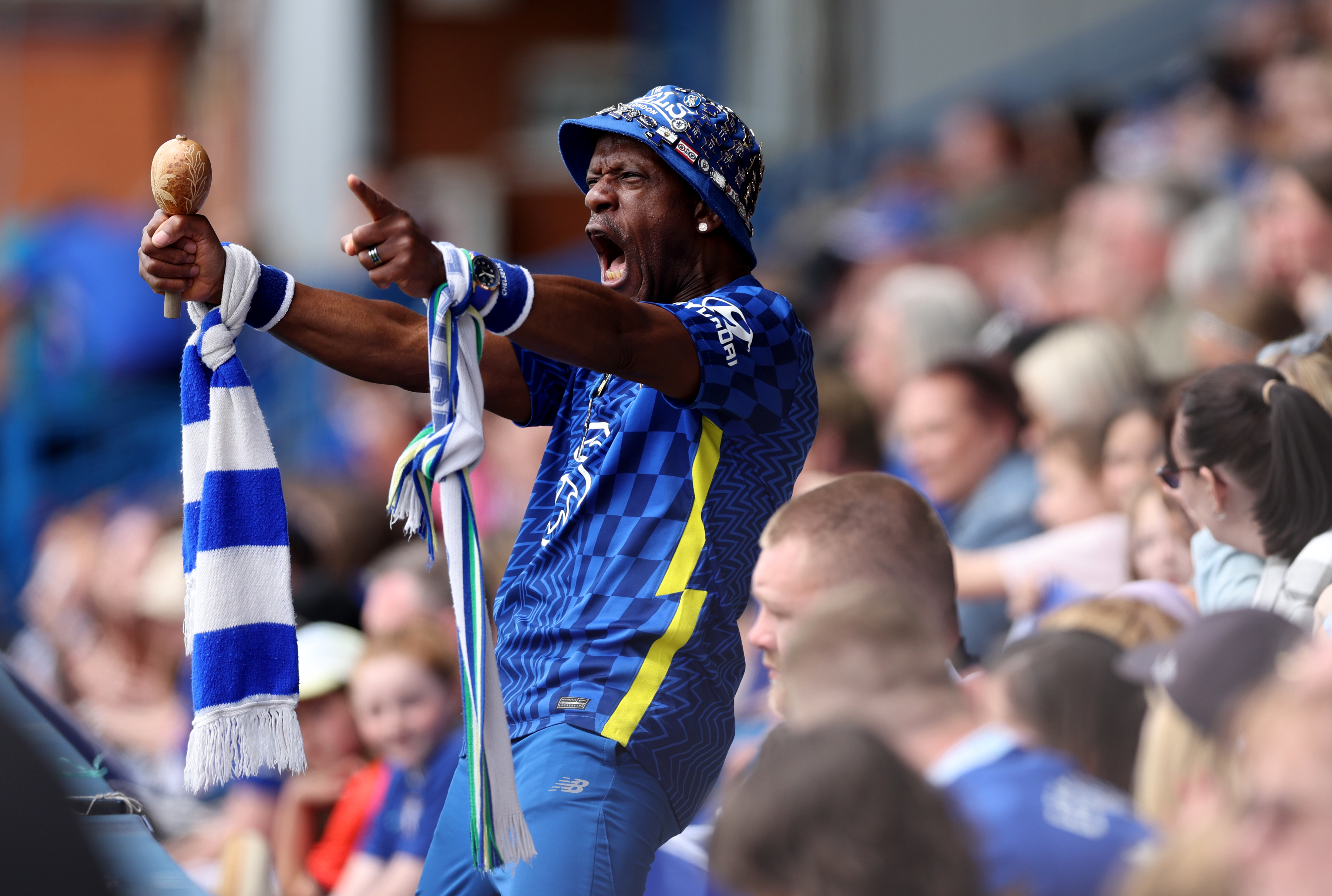 A Chelsea fan celebrates during their victory over Arsenal