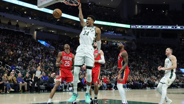 Giannis Antetokounmpo dunks home two of his 50 points against the Pelicans