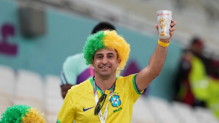 A fan of Brazil drinking a non-alcoholic Budweiser Zero beer at a World Cup match in Qatar last year (Peter Byrne/PA)