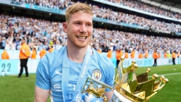 Kevin De Bruyne holds the Premier League trophy after Manchester City's 3-2 win over Aston Villa