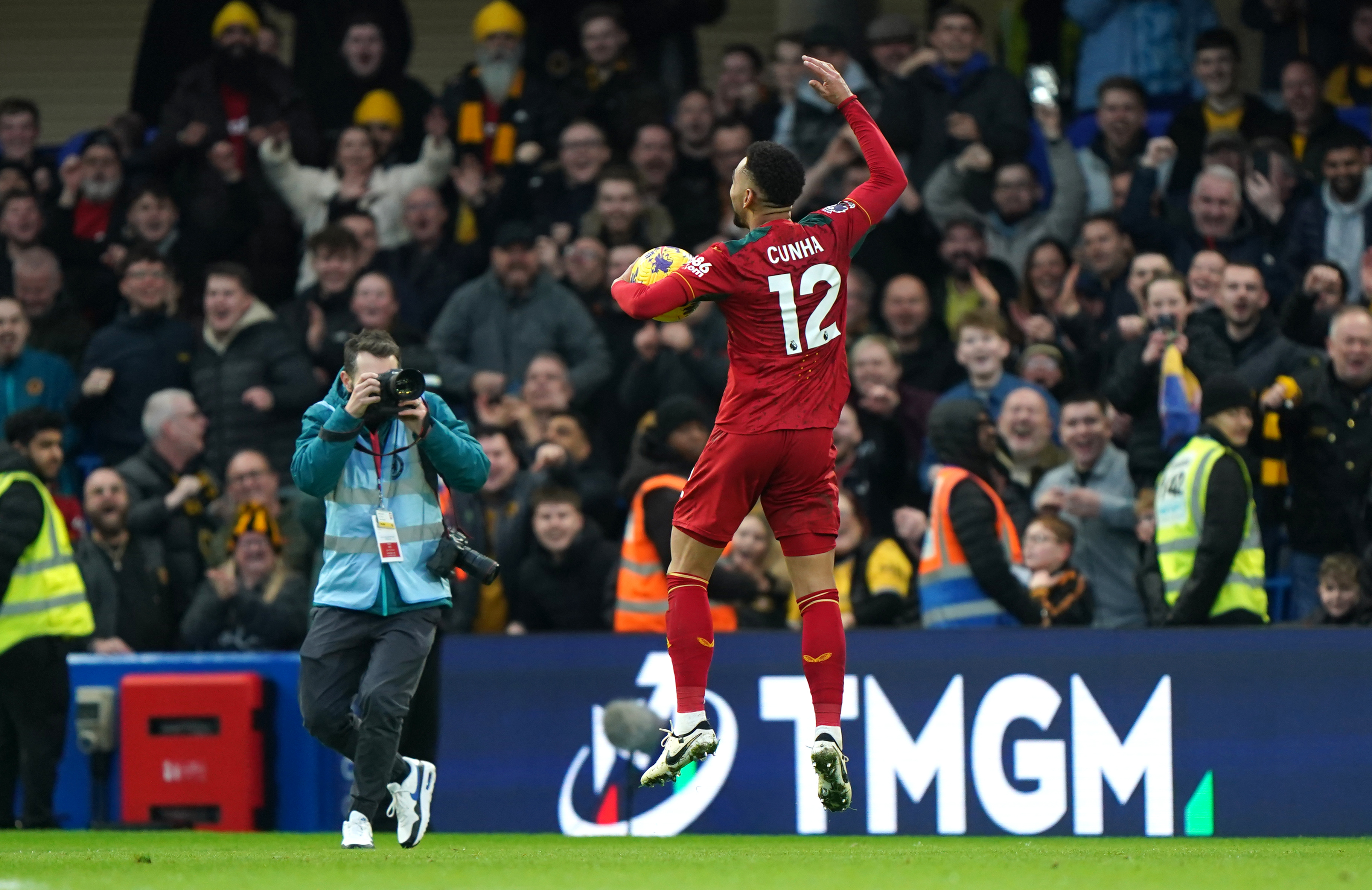 Matheus Cunha celebrates with the match ball at full time