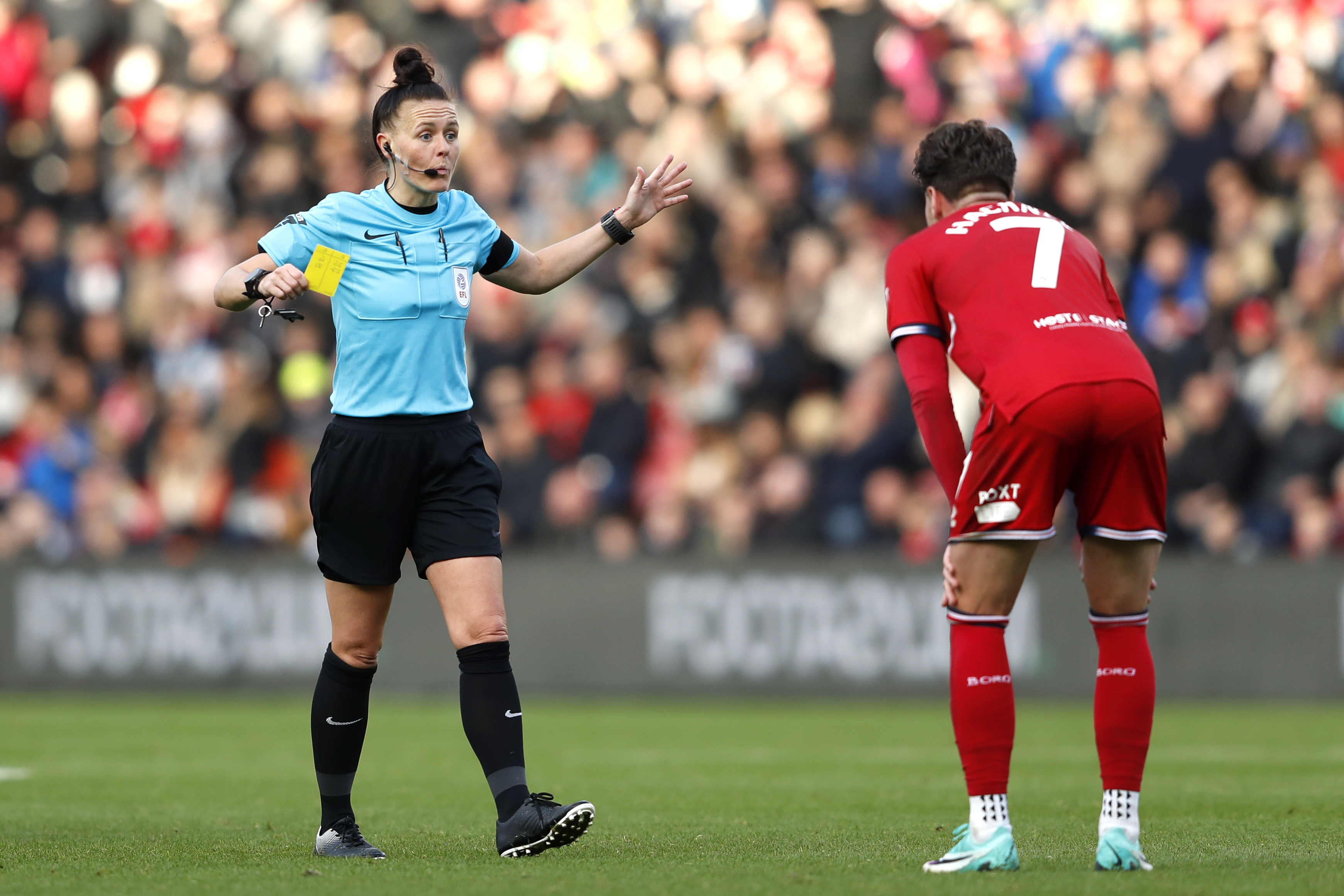 Referee Rebecca Welch (left) shows a yellow card to Middlesbrough’s Hayden Hackney